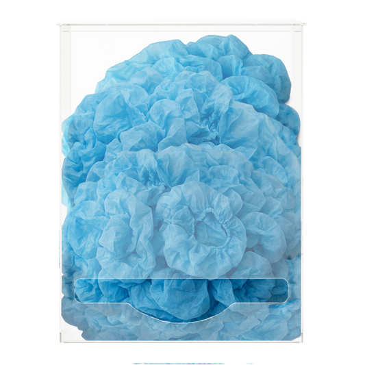 Blue bouffant caps in a clear plastic single bulk dispensers. LIdded top for loading and front bottom hole for dispensing. 